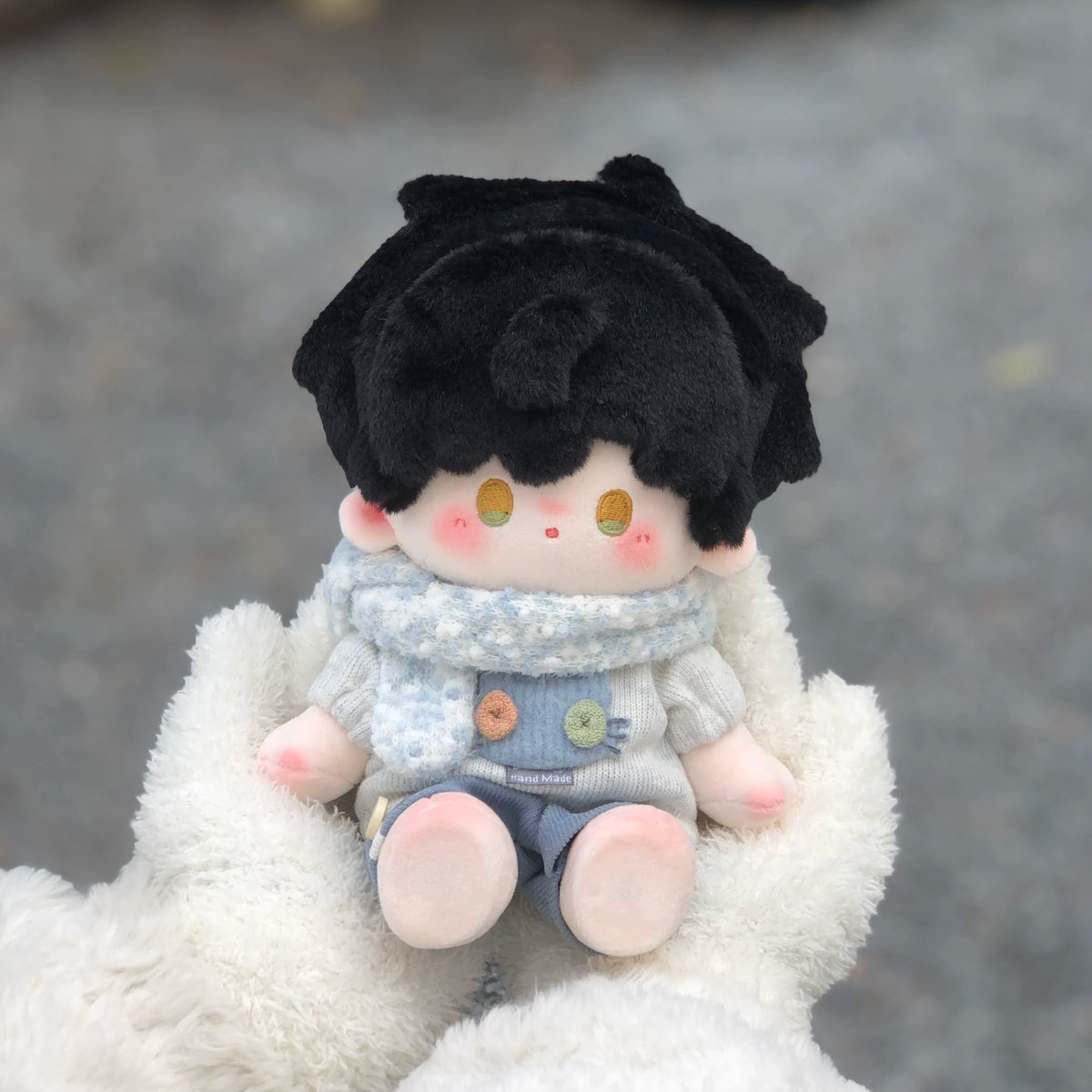 Love and Deepspace Manman-Body plush doll black hair sitting on white fur outdoors