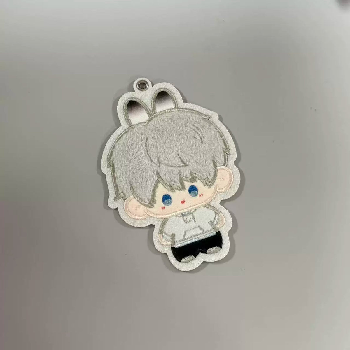 Fan-made Xavier embroidered plush charm with rabbit-ear design