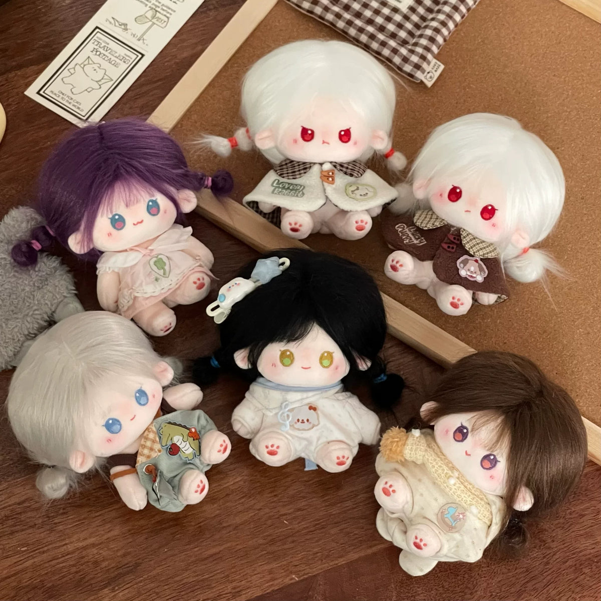 Love and Deepspace Tousled-Hair plush dolls five dolls on wooden surface group view