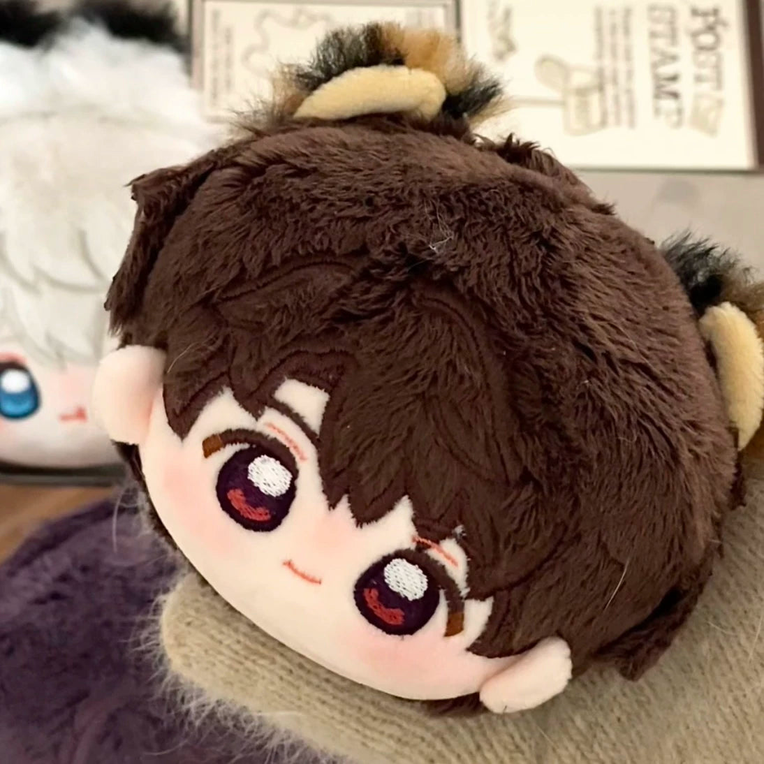 Love and Deepspace round-head plush charm brown-haired character close-up
