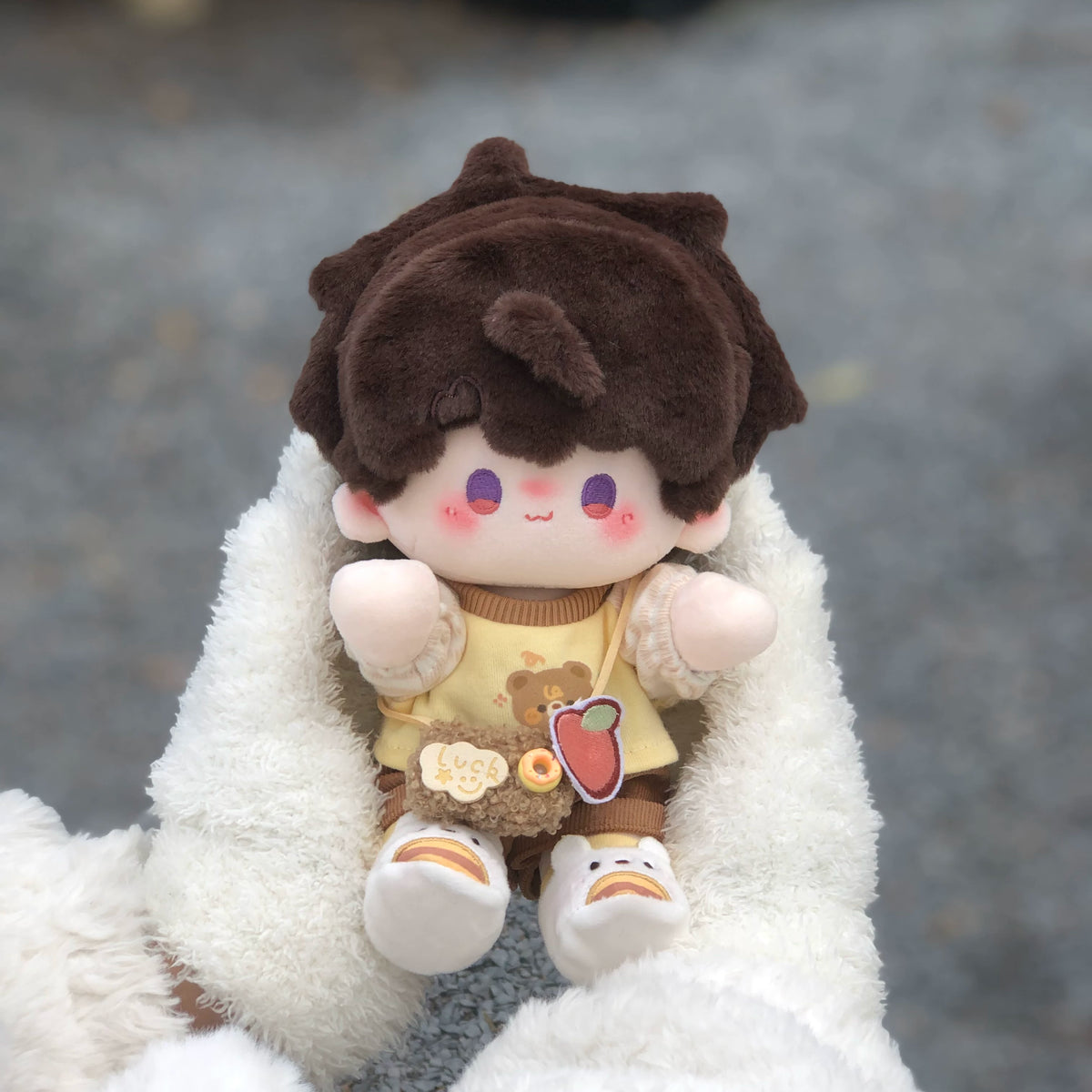 Love and Deepspace Manman-Body plush doll brown hair sitting on white fur outdoors