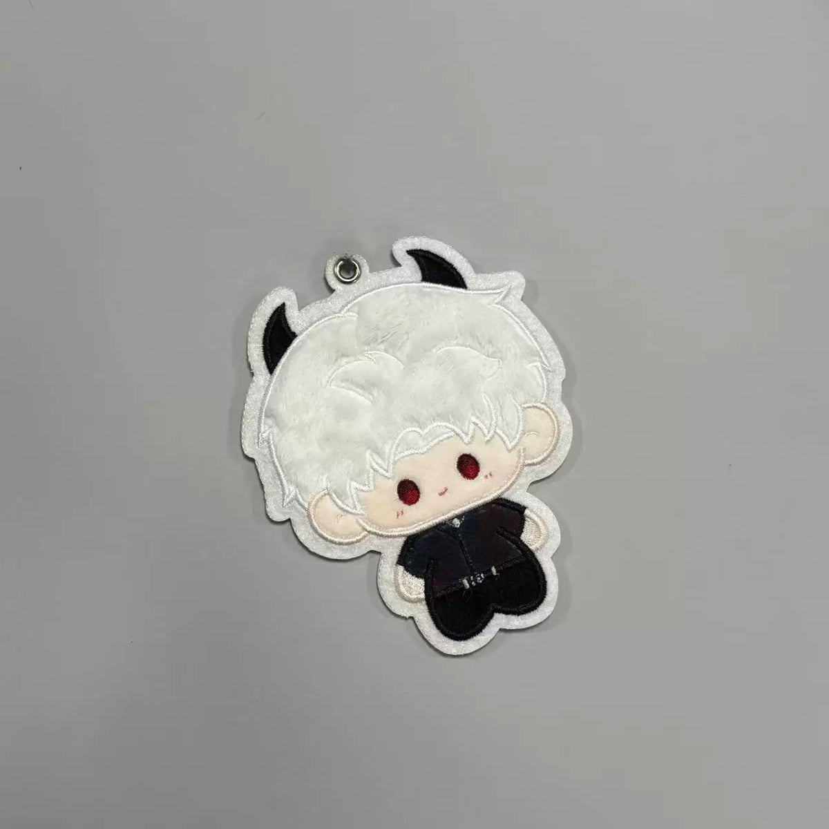 Fan-made Sylus embroidered plush charm with white horn design