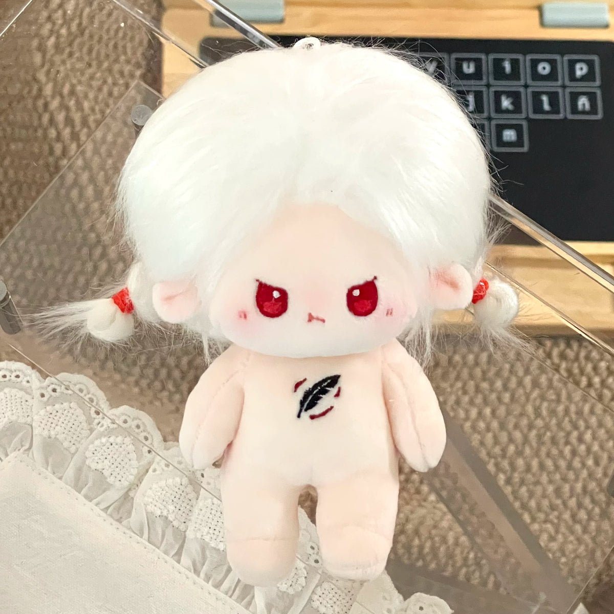 Love and Deepspace Tousled-Hair plush doll white hair red eyes with red ornaments close-up