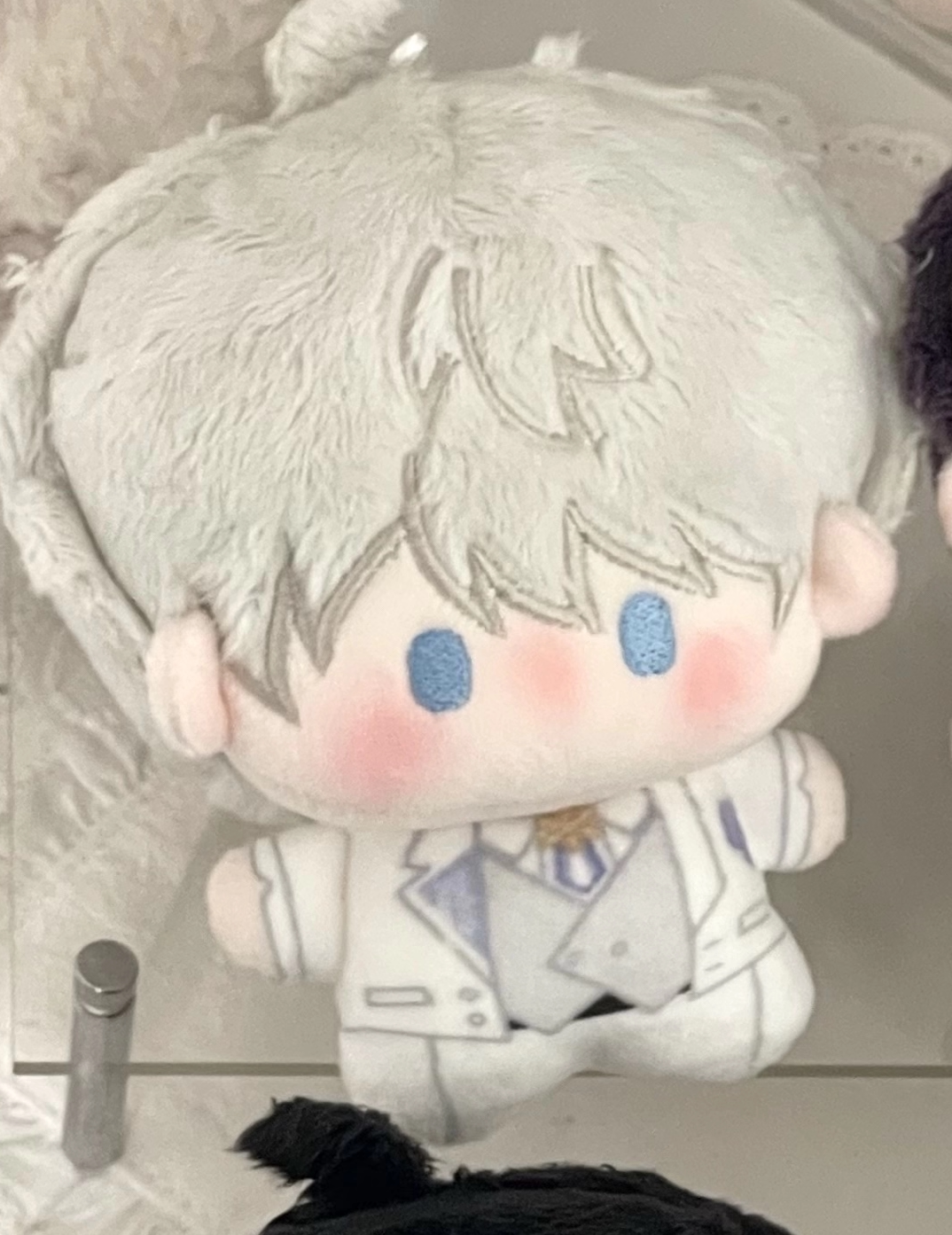 Love and Deepspace Birthday plush charm white hair doll close-up