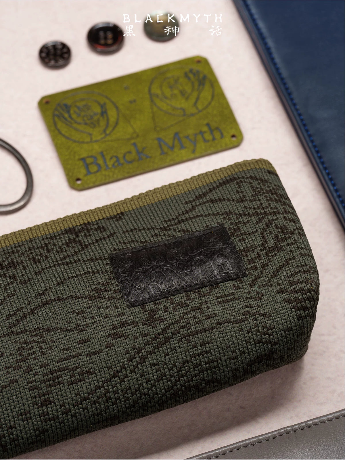 Black Myth: Wukong textured knit pencil case close-up