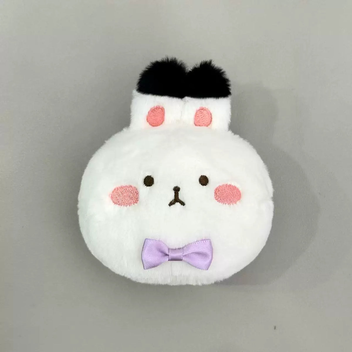 Love and Deepspace Four Mascot Series plush charm white rabbit with purple bow tie angled view