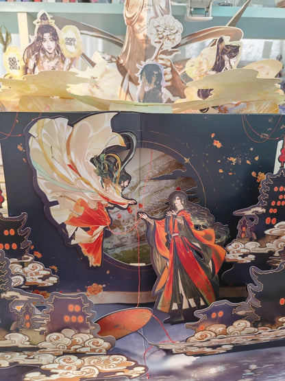 TGCF pop-up book close view of layered central characters