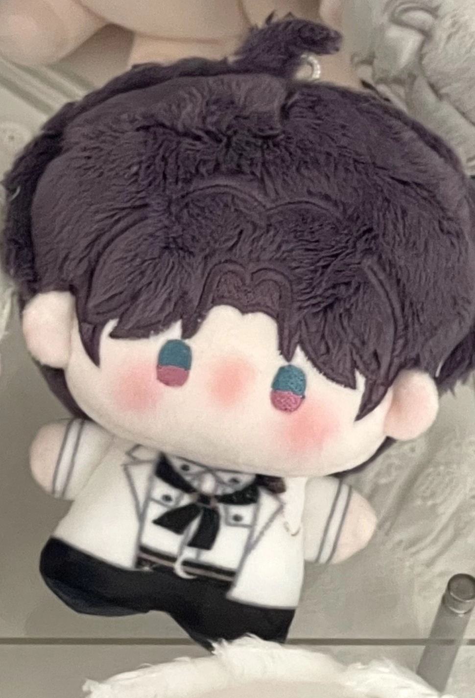 Love and Deepspace Birthday plush charm purple hair doll close-up