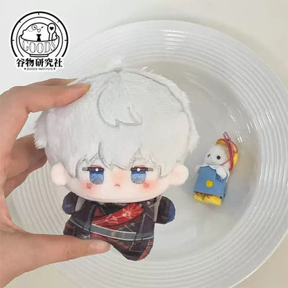 Love and Deepspace Xavier 10 cm nunu plush doll in dark red and black outfit on a plate
