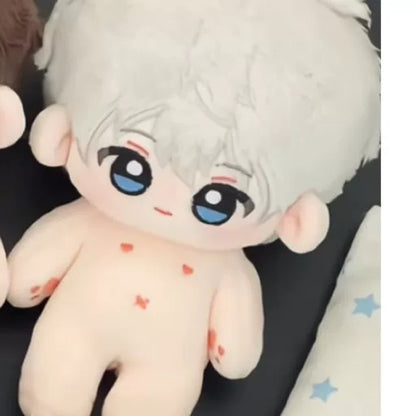 Love and Deepspace bare plush doll white hair and blue eyes lying on star-printed sheet