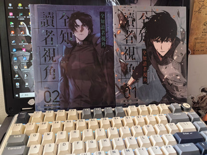 ORV Traditional Chinese manhwa Vol. 1 and Vol. 2 beside keyboard