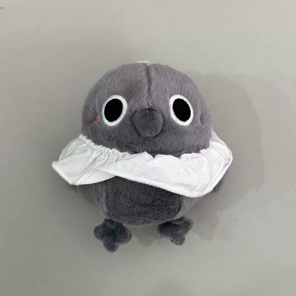 Love and Deepspace Four Mascot Series plush charm gray bird with white ruffled collar close-up