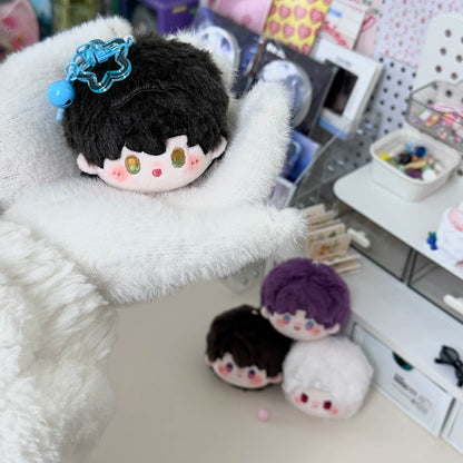 Love and Deepspace round plush doll charms black and purple hair on fluffy blanket