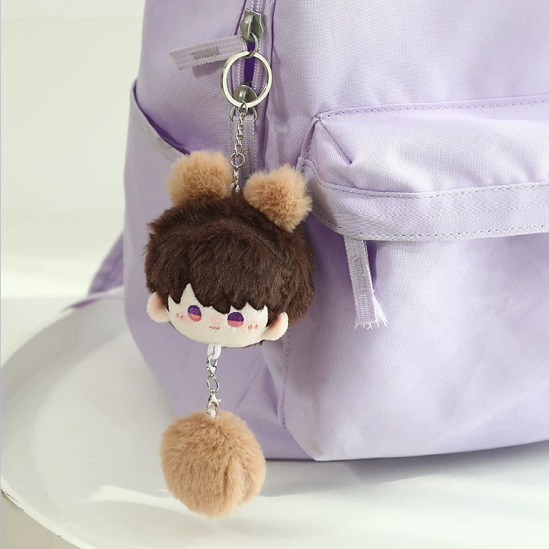 Love and Deepspace Pom-Pom plush charm brown hair with pom-pom hanging on bag