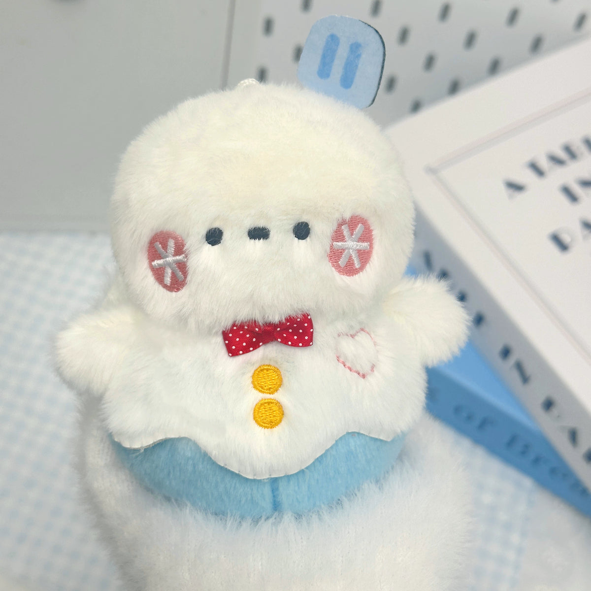 Love and Deepspace Four Mascot Series plush charm white chick with red bow tie close-up