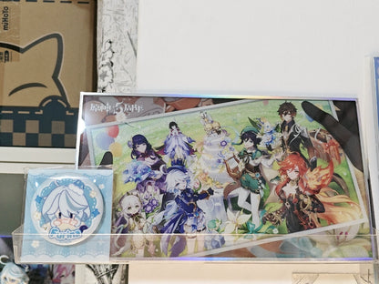 Genshin Impact anniversary acrylic art board displayed with badge and packaging