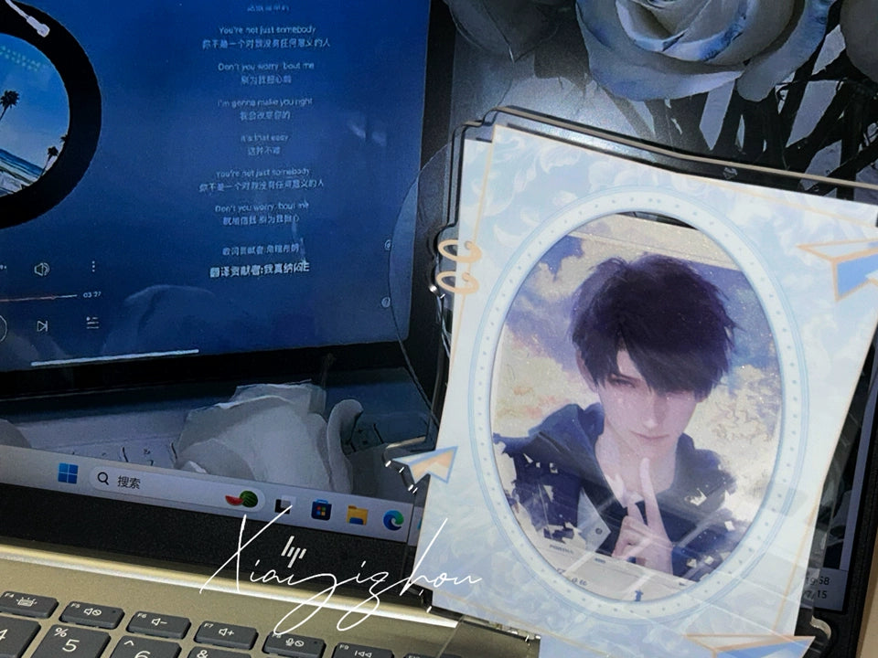 Love and Deepspace Caleb Lingering Affection standee displayed beside a laptop