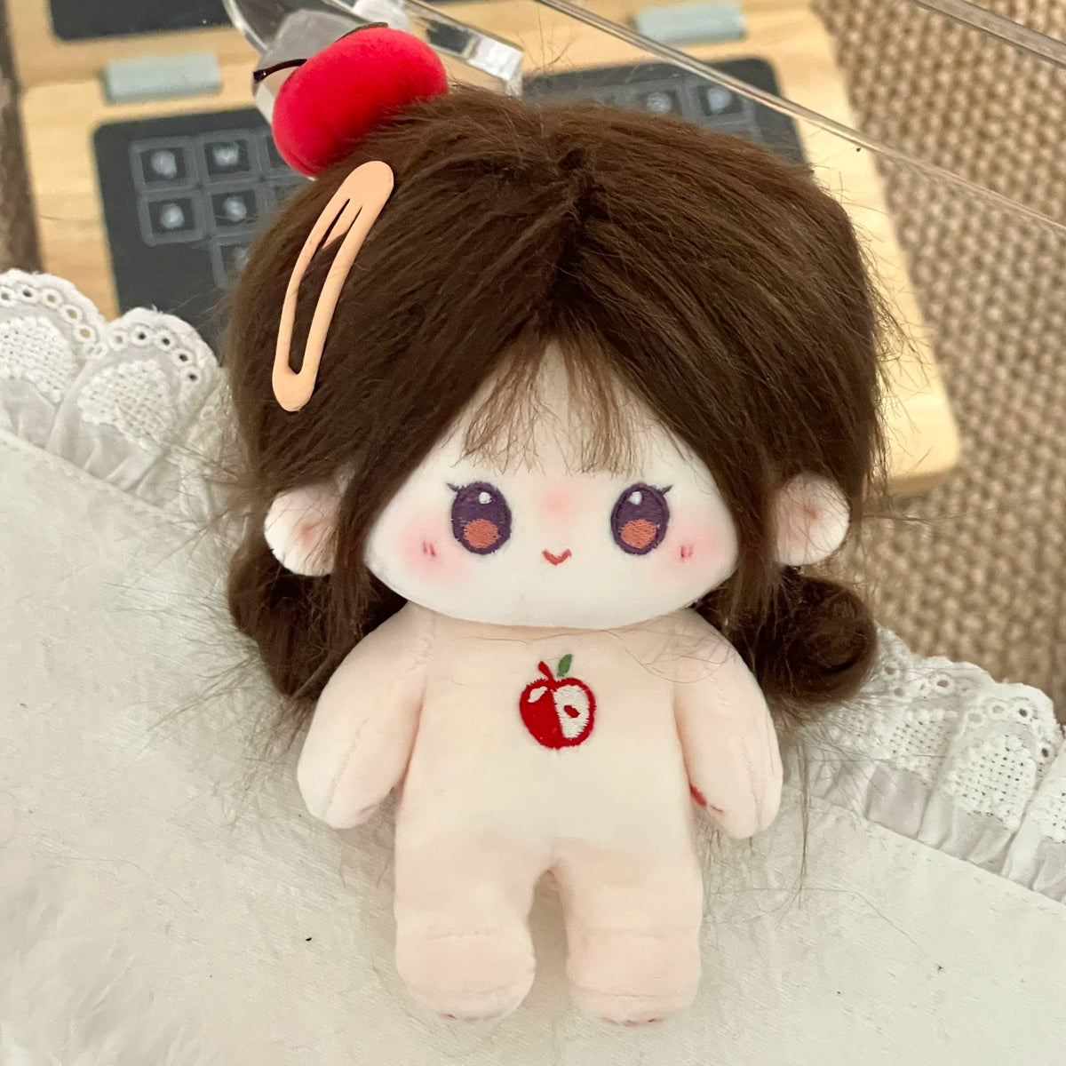 Love and Deepspace Tousled-Hair plush doll brown hair with apple motif close-up