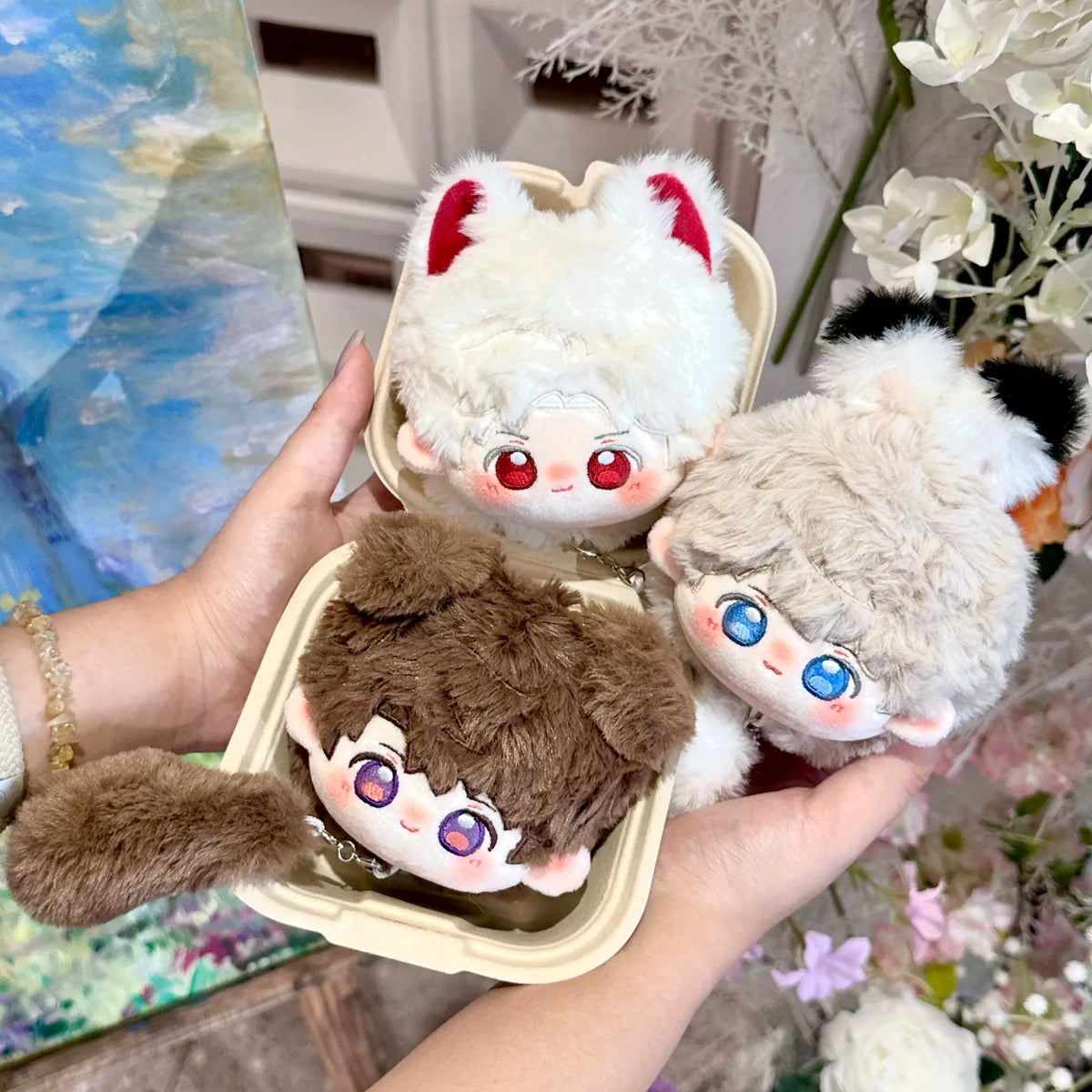 Love and Deepspace tail bun plush dolls three designs held in hand
